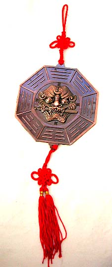 World of FENG SHUI - Metallic 'BA GUA' with evil face holding a sword in mouth. It allways hang out side of the house door to keep the house from devil and bad spirit.