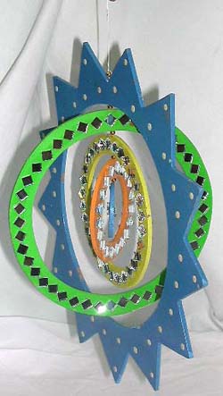Assorted color comet wooden mobile with circle pattern design rotating center 