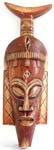 Brown narrow down wooden mask with fish tail top and long ears