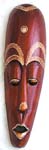 Long brown wooden mask with eye closed and yellow decor on eyes, nose and lips