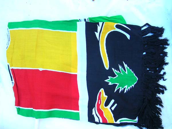 Caribbean leisure beach dress wrap in green, yellow, and red fashion print from online fashion gift b2b trade dealer