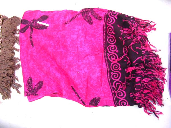 Beach blanket sarong in pink with black spiral border and dragonfly pattern from online wholesale supplier