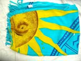 Astrological print design with sun theme on aqua blue summer sarong from international wholesale boutque