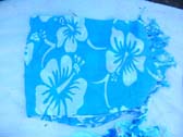 Online beach wear collection exchange imports hibiscus design on handcrafted batik shawl wrap
