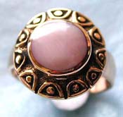  bronze ring with flower pattern holding a rounded genuine white mother of pearl seashell at center 