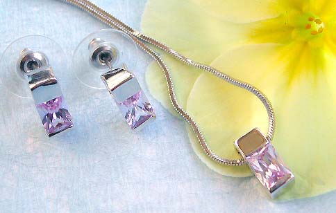 Trendy jewelry importer offering chain necklace, capped rectangular purple cz pendant and stud earring set