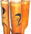 Dark brown bamboo wind chime with dolphin