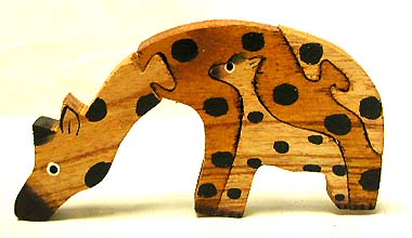 Child room decoration - color painted wooden giraffe puzzle set with giraffe's mouth tounching ground