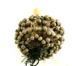 Wooden music maracas with mini seeds holding on black web design