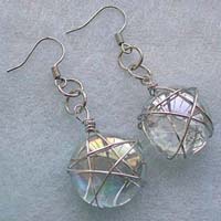 Fish hook fashion earring with wired-in star transparent white glass bead suspended on bottom