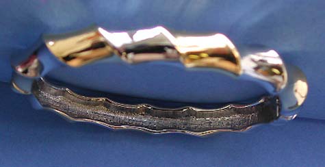 twisted bone shape design fashion bangle bracelet in gold and silver 2-tones fashion, brass inside, finished with rhodium and gold plating to creat a platinum look