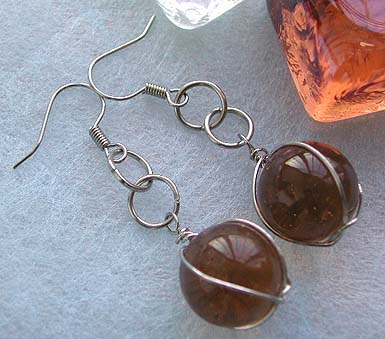 Costume fashion earring wholesaler, double loop fashion earring with wired-in brown glass bead suspended