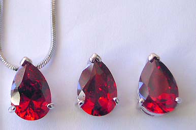 Fine jewelry wholesaler presenting chain necklace, water drop garnet cz pendant and stud earring set
